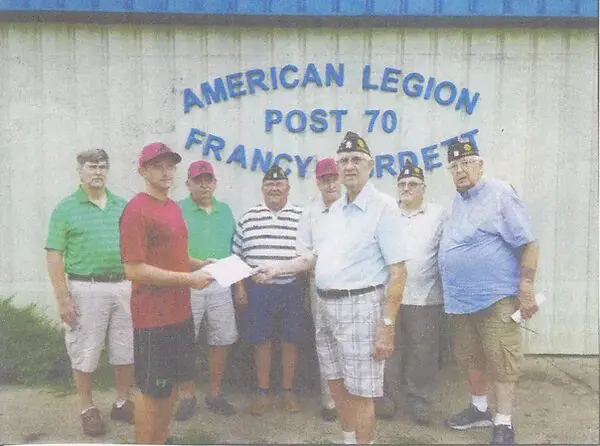 A group of veterans receiving an award