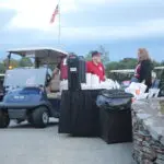 A Group of People With Trash Bags and Covers