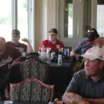 A Group of People Siting by Tables