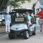 A Golf Cart With GPI Words on a Cart