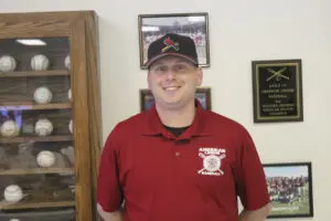 Head Coach Brian Pegg in a Maroon Top Headshot