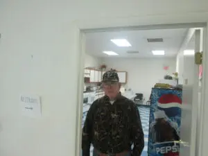 A Man Standing in Front of a Kitchen