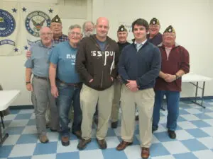 A Group of People Standing on a Checker Floor