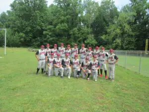 A Group of Baseball Players Posing on the Ground