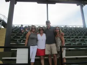 A Man Standing With Three Women in a Photo