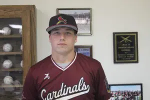 Garrett McCurry in Maroon Color Top Headshot One