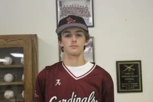 Cade Leik in a Maroon Color Top Headshot