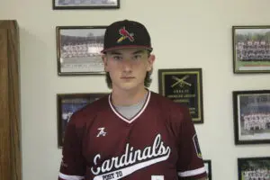 Walker Fox in a Maroon Color Top Headshot One