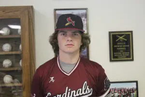 Rex Miller in a Maroon Color Top Headshot One