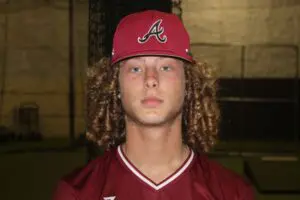 Aaron Dover in a Maroon Color Baseball Top One