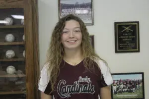 Ivy Holly in a Baseball Jersey Smiling Headshot