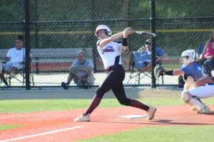 A Woman Holding a Baseball Bat on the Pitch